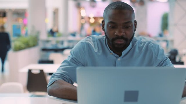 black guy on laptop, onyx truth.jpg