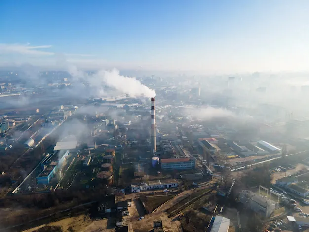 aerial-drone-view-chisinau-thermal-station-with-smoke-coming-out-tube-buildings-roads-fog-air-moldova_1268-16960.webp