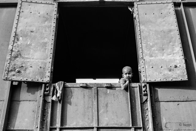 Little boy looking through the train window .jpg