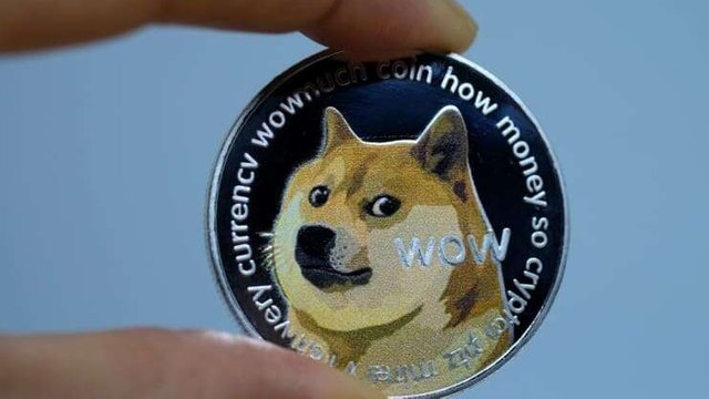 106869851-1618607422719-gettyimages-1299388450-yn_dogecoinillustration_001.jpeg