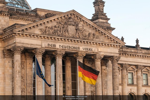 cbpictures_20130420_0008--Reichstag_building_with_Germany_flag__European_flag_and_the_letting__DEM_DEUTSCHEN_VOLKE___German_for__to_the_German_people___Government_District__Berlin__Germany_xgaplus.jpg
