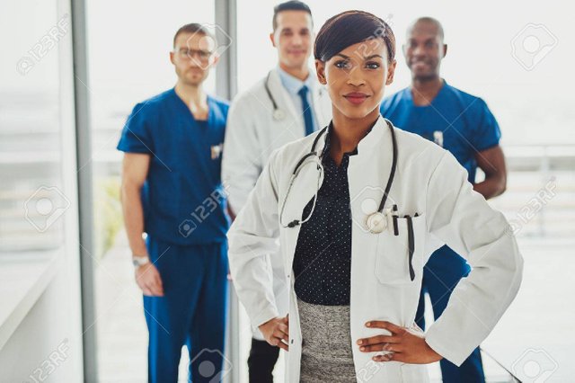 54832373-black-female-doctor-in-charge-at-hospital-leading-medical-team-om-doctors-and-surgeons.jpg