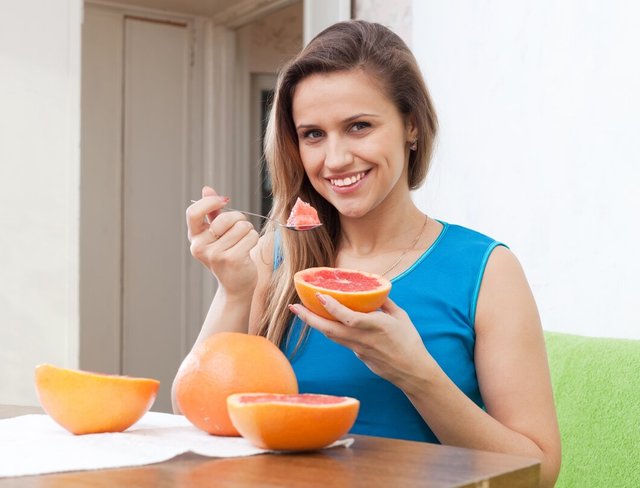 beautiful-girl-eats-grapefruit-with-spoon_1398-5158.jpg