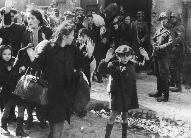 boy hands up warsaw ghetto.jpg