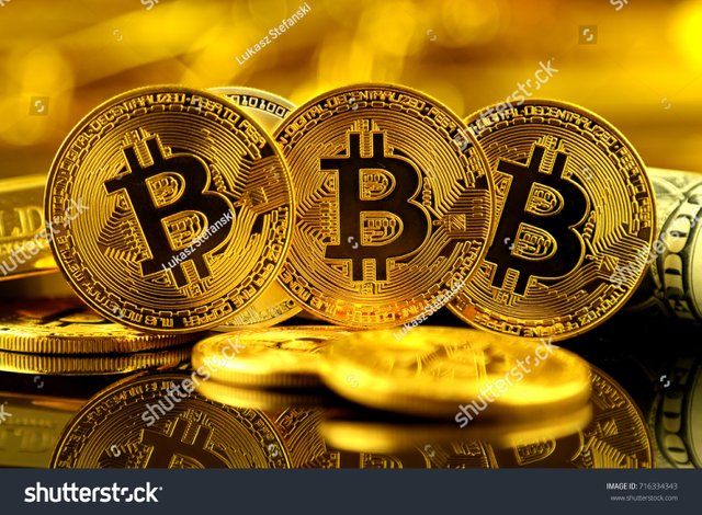 2 - stock-photo-physical-version-of-bitcoin-new-virtual-money-and-banknotes-of-one-dollar-exchange-bitcoin-for-a-716334343.jpg