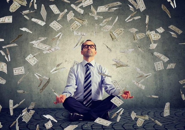 mindset-of-financially-successful-people-man-in-yoga-position-with-money_small-1200x844.jpg