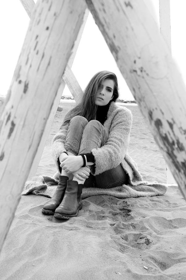 sad-woman-sitting-beach-feeling-lost-alone-looking-camera-black-white-concept-loneliness-sadness-92599577.jpg