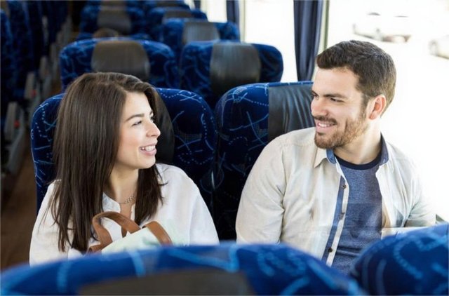 Two passengers talking to one another in pleasant mood.jpg