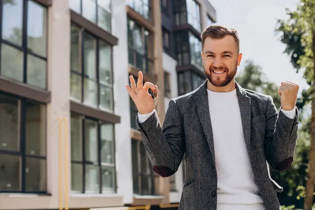 young-man-with-keys-just-bought-new-appartment_1303-28900.webp