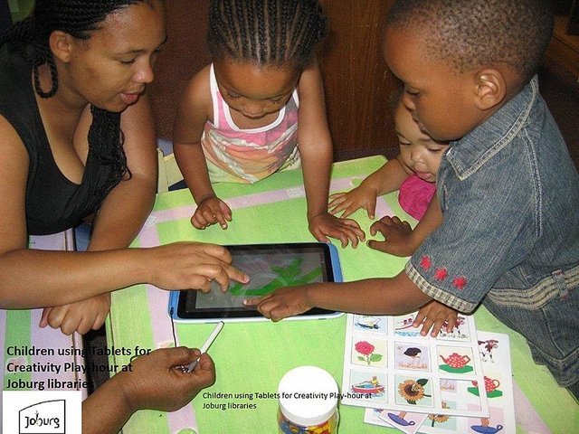 800px-Children_using_tablets_at_City_of_Joburg_libraries_to_draw_art_with_parents.jpg