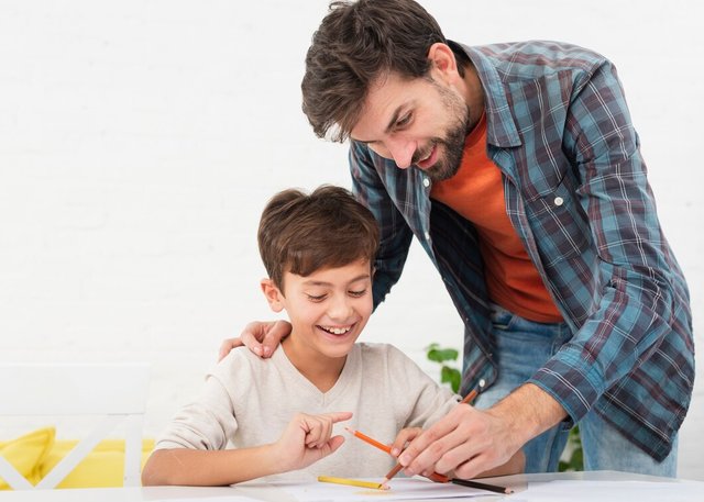 happy-father-son-doing-homework_23-2148350763.jpg