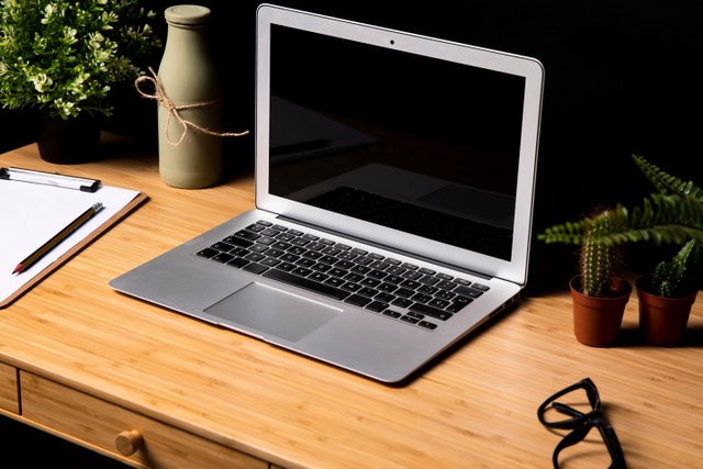 gray-laptop-simple-wooden-desk.jpg