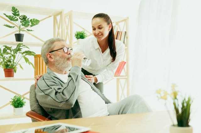 daughter-granddaughter-spends-time-with-grandfather-senior-man-drinking-water_155003-20954.jpg