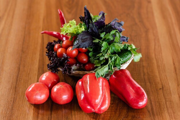 red-tomatoes-cucumbers-red-paprika-peppers-wooden-table-surface_502065-935.jpg