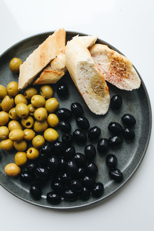 photo-of-sliced-bread-beside-olives-4109911.jpg