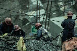 free-photo-of-group-of-people-searching-gold-in-a-pile-of-mine-waste-during-the-rain.jpeg