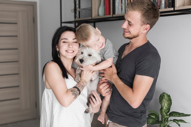 portrait-of-happy-family-with-their-dog.jpg