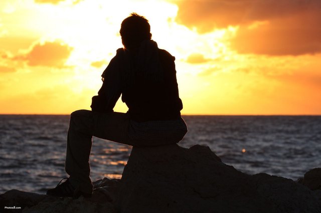 man_sitting_and_watching_sunset-other.jpg