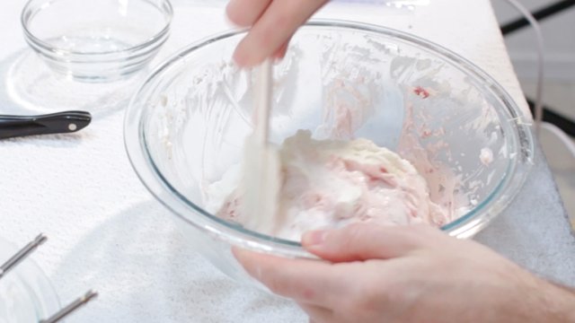 folding together the strawberry cream cheese and whipped cream.jpg