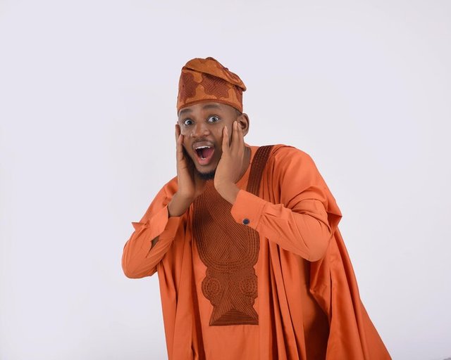 african-man-wearing-yoruba-nigerian-native-traditional-attire-agbada-shocked-surprised-alarmed_659766-3.jpg