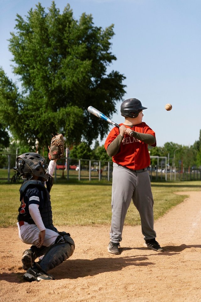 full-shot-kid-holding-baseball-bat_23-2149457294.jpg