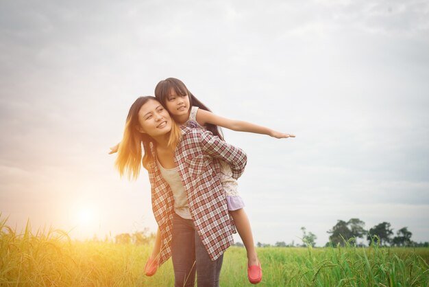 portrait-mom-daughter-playing-outdoor-enjoying-family-time_1150-836.jpg