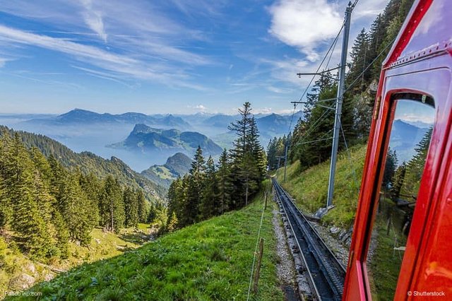 The-Pilatus-train-the-worlds-steepest-cogwheel-railway-nears-the-top-of-Mount-Pilatus-as-it-emerges-from-the-clouds.jpg