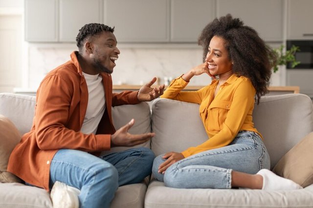 happy-african-american-spouses-talking-flirting-sitting-home_116547-94245.jpg