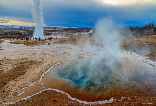 Blue-pool-with-the-Strokkur-Geyser-in-Iceland.jpg