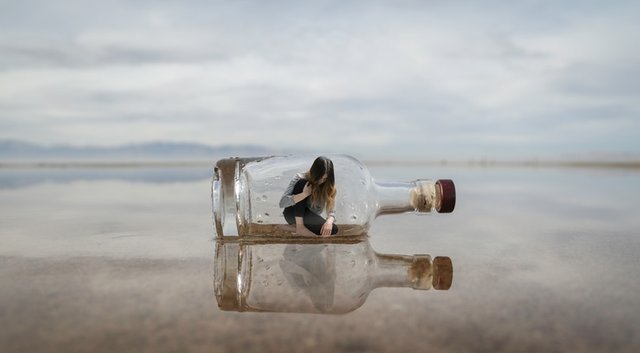 person-trapped-in-bottle-on-beach.jpeg