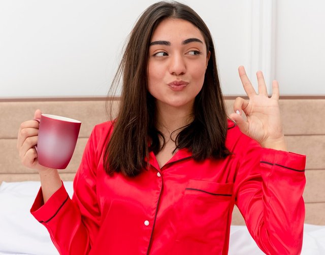 young-beautiful-woman-red-pajamas-relaxing-bed_141793-46818.jpg