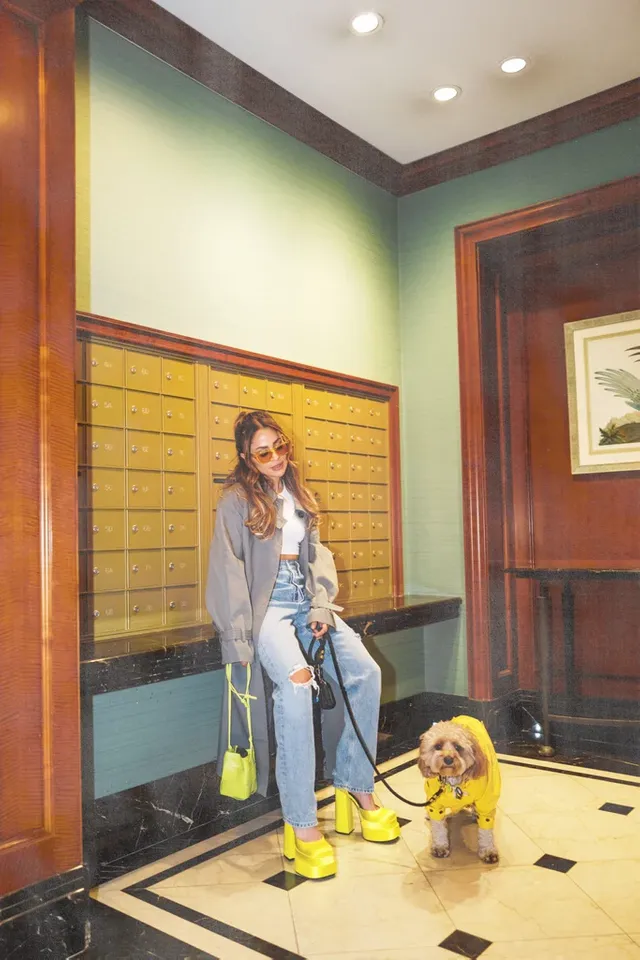 Amato-walks-her-dog-Tobi-wearing-yellow-Medusa-Versace-platforms.webp