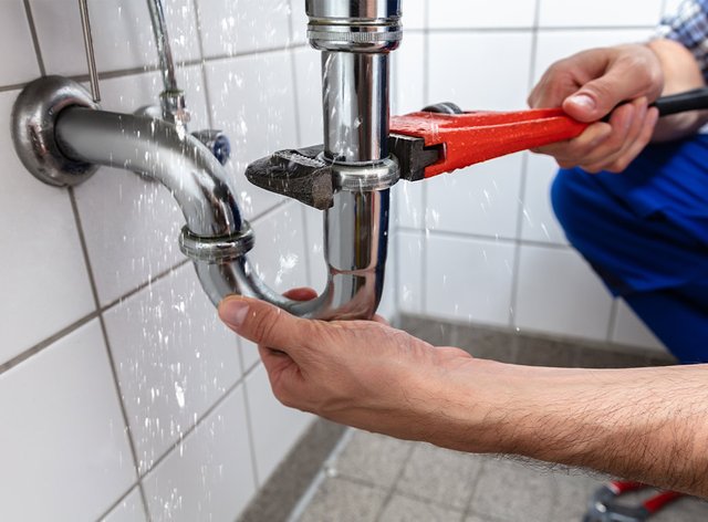 plumber-rates-fixing-sink-pipe.jpg