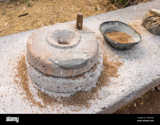 ancient-grain-hand-grinding-millstones-2C0NCR0.jpg