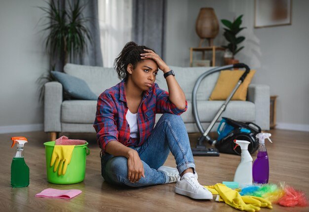 frustrated-tired-unhappy-young-black-woman-housewife-suffering-from-lot-housework-sit-floor_116547-28525.jpg