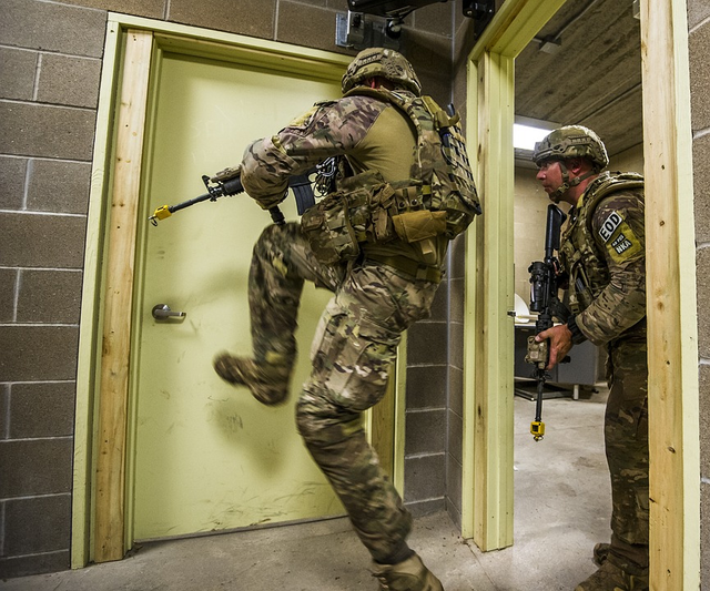 MILITARY PERSONNEL ASSEMBLING MYSTERIOUS CONTAINERS.png