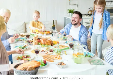 portrait-happy-family-enjoying-dinner-260nw-1095583328.webp