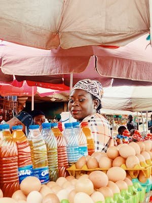 free-photo-of-a-woman-selling-eggs-and-other-items-at-a-market.jpeg