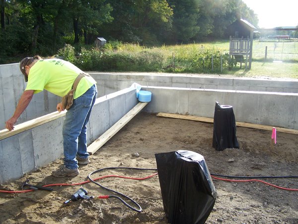 Construction - bolting the sills down2 crop Sept. 2019.jpg