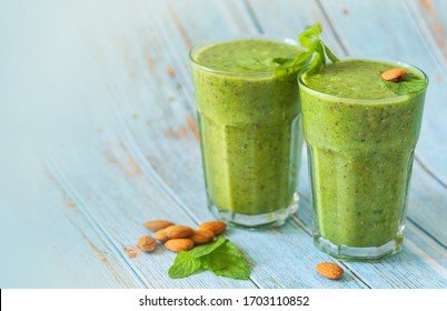 green-smoothie-glass-over-blue-260nw-1703110852.jpg