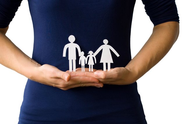woman-holding-paper-cut-out-family.jpg