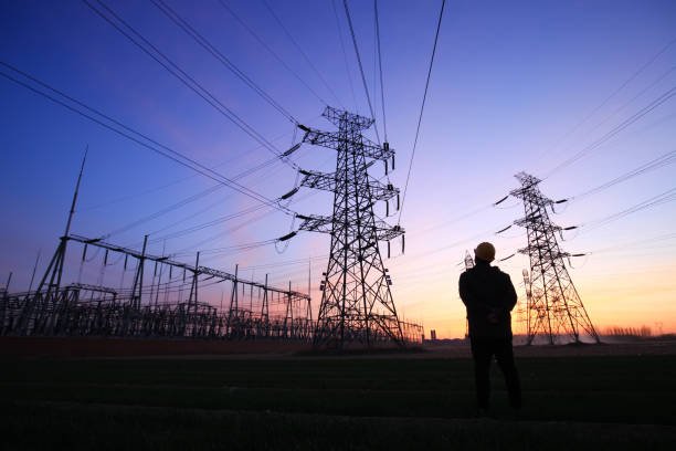 electricity-workers-and-pylon-silhouette.jpg