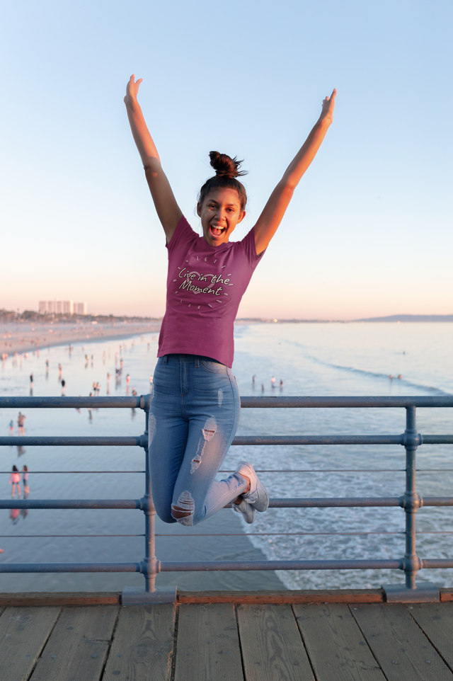 t-shirt-mockup-of-a-girl-jumping-on-a-pier-at-the-beach-18217.png