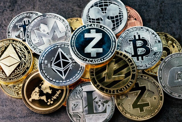 crypto-currency-background-with-various-of-shiny-silver-and-golden-physical-cryptocurrencies-symbol-coins-bitcoin-ethereum-litecoin-zcash-ripple-stockpack-adobe-stock-1597x1065.jpg
