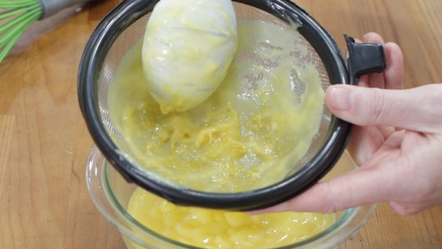 straining the lemon curd.jpg