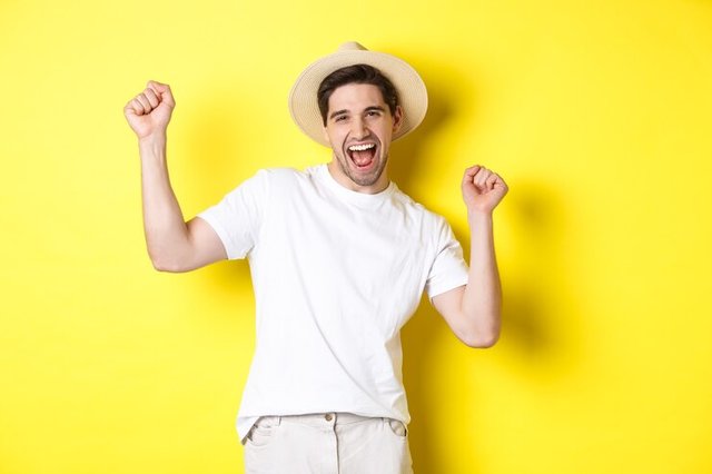 concept-tourism-lifestyle-happy-man-tourist-celebrating-rejoicing-vacation-standing-yellow-background_1258-40847.jpg