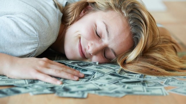 lady sleeping money.jpeg