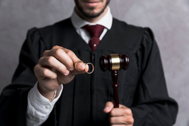 close-up-judge-with-golden-rings-gavel_23-2148230762.jpg