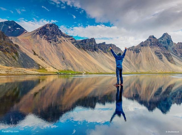 Amazing-reflection.-Photographer-taking-photo-of-famous-Vestrahorn-Mountain.jpg