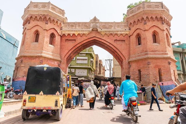 multan-haram-gate-picturesque-view-rickshaw-walking-people-motorbikes-sunny-blue-sky-day-multan-haram-gate-167709490.jpg